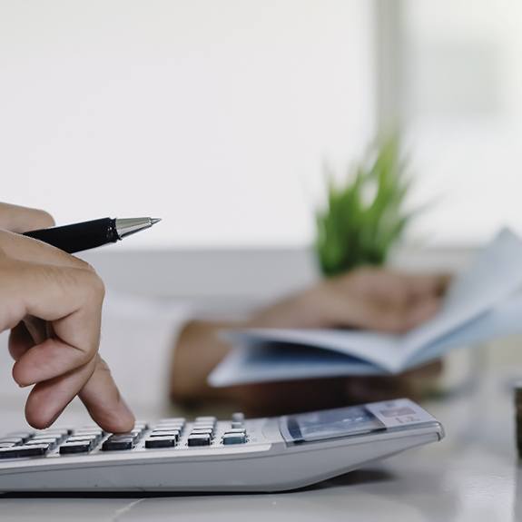 Man using a calculator