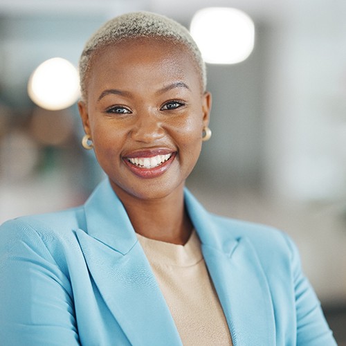 Closeup of woman in blue blazer smiling