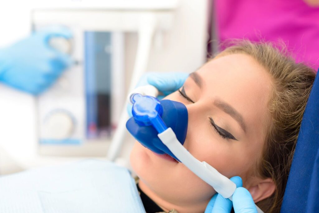 A woman receiving nitrous oxide sedation.