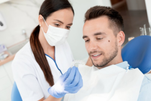 Dentist showing patient a ClearCorrect tray